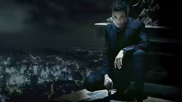 Cha Tae-sik (Won Bin) crouches on a rooftop above a city at night
