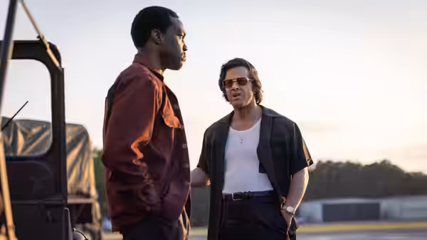 Wayne Strider (Yahya Abdul-Mateen II) faces Gregory Scarpa (Mark Wahlberg) outdoors
