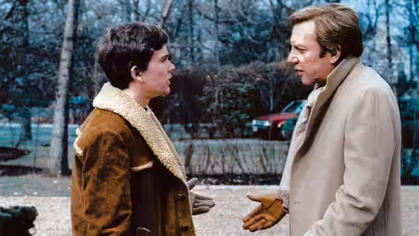 Conrad Jarrett (Timothy Hutton) facing Calvin Jarrett (Donald Sutherland) outdoors in conversation