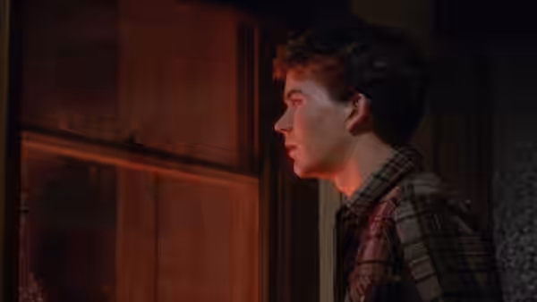 Conrad Jarrett (Timothy Hutton) looking out a window at night