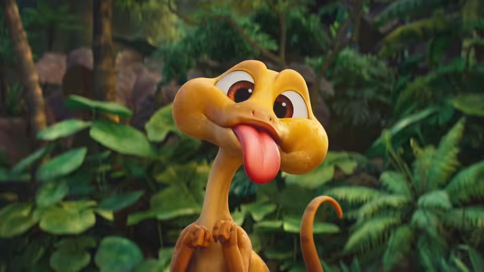 A yellow dinosaur sticks out its tongue in a lush jungle