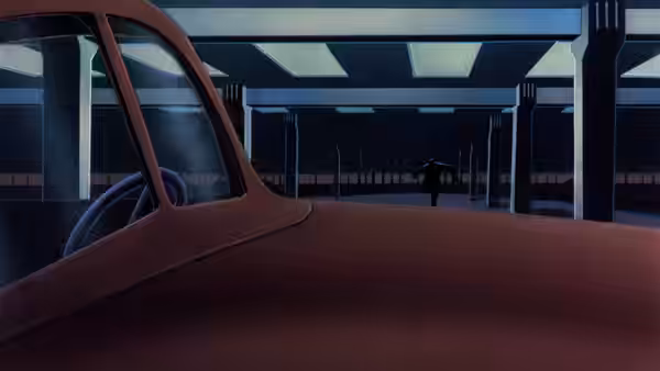A lone figure walks through an empty parking structure at night