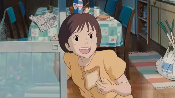 Smiling girl holds slice of bread while leaning through a doorway
