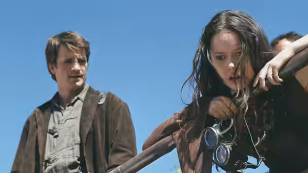 River Tam (Summer Glau) gripping a railing with Simon Tam (Sean Maher) beside her