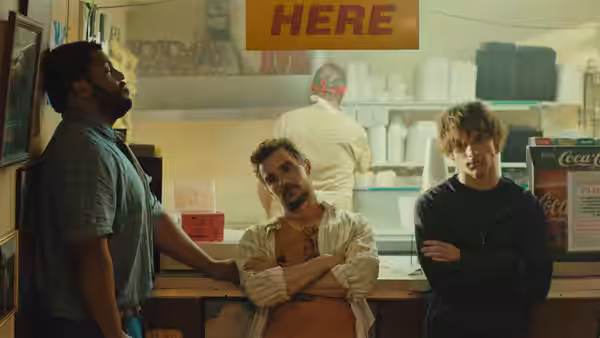 Davis Mark and Sheridan standing inside a convenience store