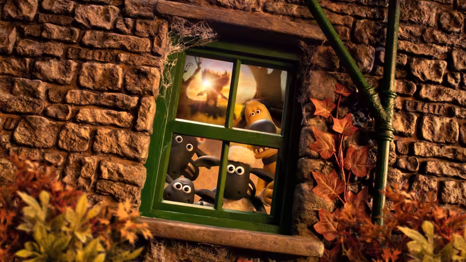 sheep peering out of a green window in a stone wall at night