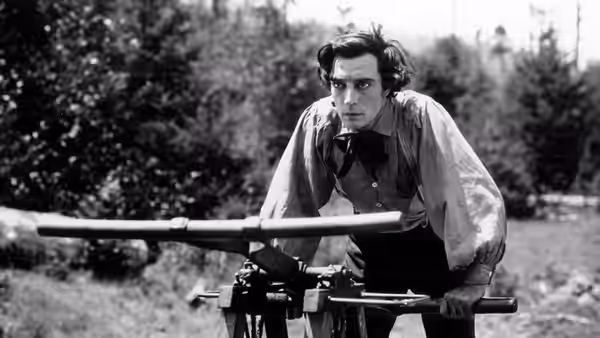 Johnnie Gray (Buster Keaton) operating a cannon in the woods