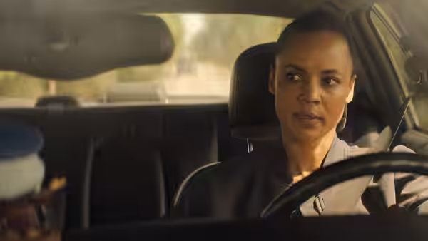 Frances Neagley (Maria Sten) driving a car while looking to the side