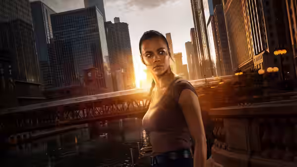 Frances Neagley (Maria Sten) on a bridge overlooking the river at sunset