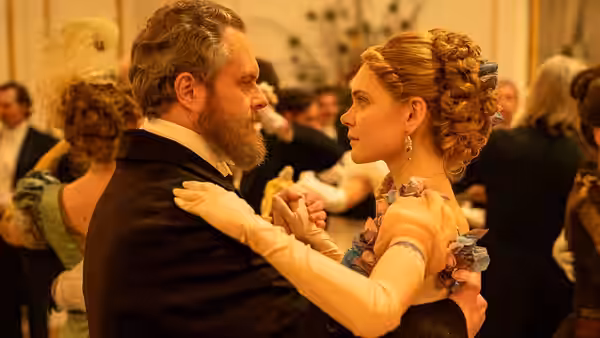 Izabela Łęcka (Sandra Drzymalska) dances with Stanisław Wokulski (Tomasz Schuchardt) at a formal gathering