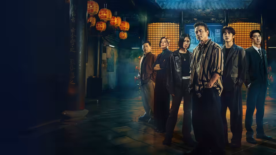Six people standing together in a lantern-lit traditional Chinese interior at night