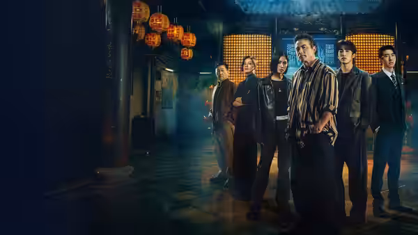 Six people standing together in a lantern-lit traditional Chinese interior at night