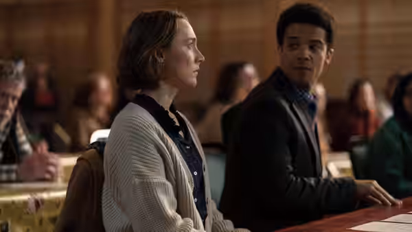 Maria (Saoirse Ronan) and Sam (Jacob Anderson) at a hearing