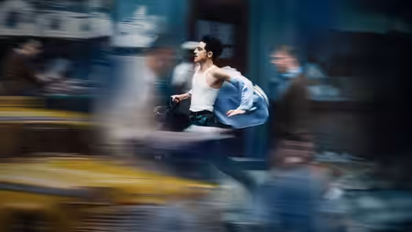 Marty Mauser (Timothée Chalamet) running through city streets with motion blur