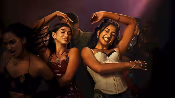 women dancing with raised arms on a crowded nightclub dance floor