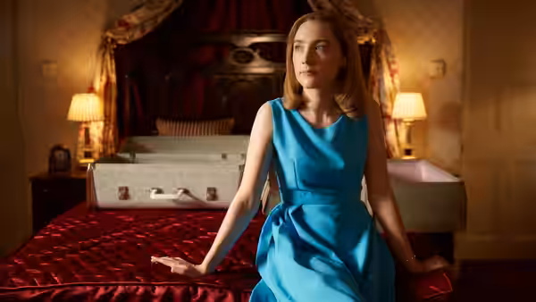 Florence Ponting (Saoirse Ronan) sitting on a bed in a bedroom