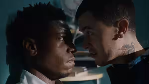 Two men facing each other closely in a tense confrontation