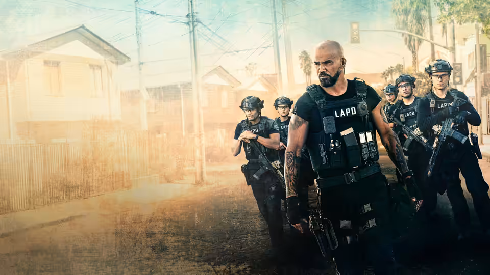 Daniel 'Hondo' Harrelson (Shemar Moore) leads armed LAPD officers down a dusty residential street