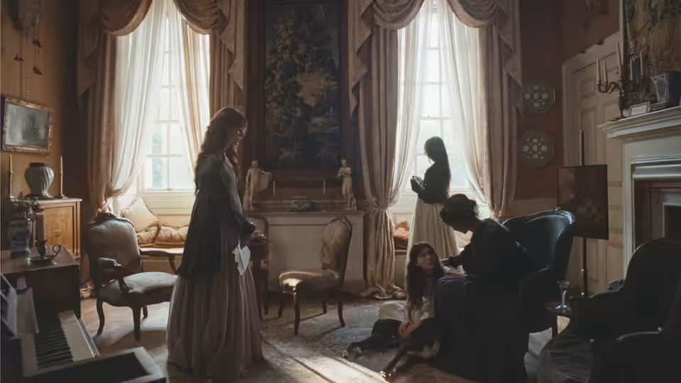 A woman stands holding a letter while others attend a girl in a drawing room