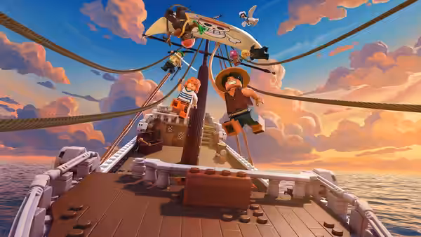 Luffy and Nami stand on the deck of a ship sailing at sunset