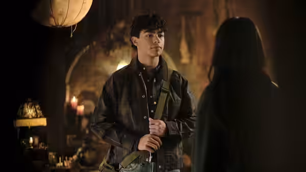 Jake faces a woman in a dimly lit candlelit room