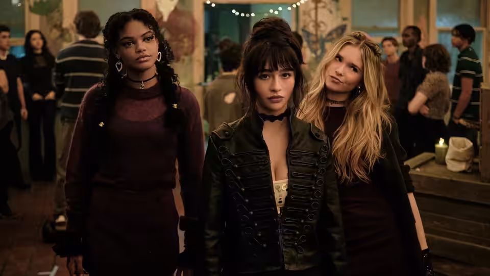 Briar Roberts (Malina Weissman) stands with Sasha and Tegan at a party