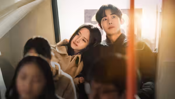 Lim Yu-jin (Kim So-hyun) leaning on Park Min-jae (Choo Young-woo) inside a vehicle