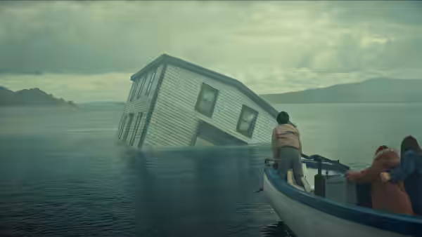People in a small boat approach a tilted house partly submerged in a lake