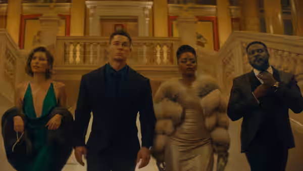 Sean (John Cena) and three formally dressed companions descend a grand staircase