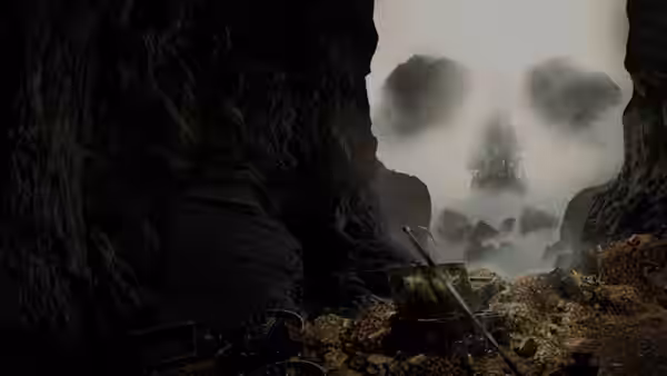 A rocky gorge opens onto a foggy landscape, with wooden debris scattered across the ground