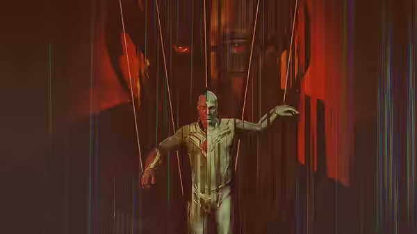 Vision hangs with arms outstretched among vertical wires, a giant face looming behind him