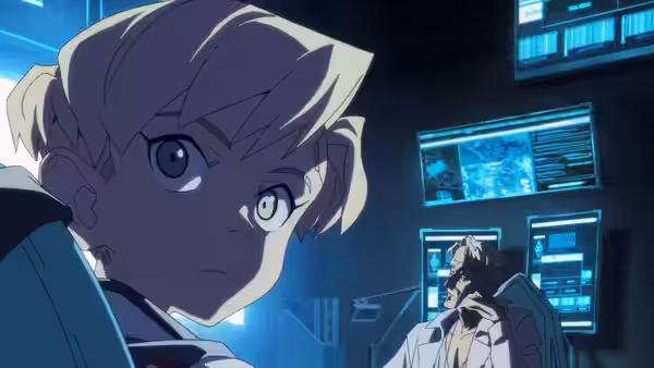 A blond young person looks back while an older man sits before glowing monitors