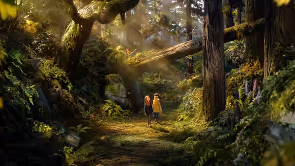 Two children stand together on a forest path