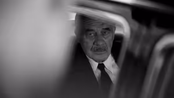 Thomas Mann (Hanns Zischler) looking out from inside a vehicle
