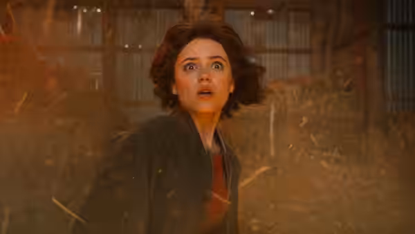 Chrissie (Amy Adams) amid sparks and dust inside a barn