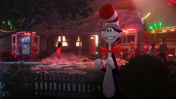The Cat in the Hat (Bill Hader) stands before a house surrounded by scattered debris