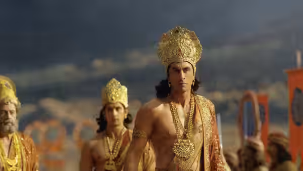 Ram (Ranbir Kapoor) walks among crowned warriors gathered outdoors