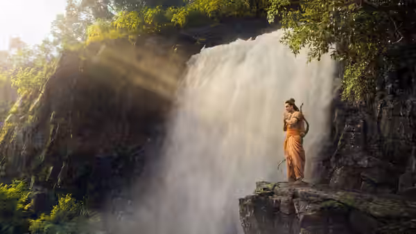 Ram (Ranbir Kapoor) standing on a cliff near a waterfall
