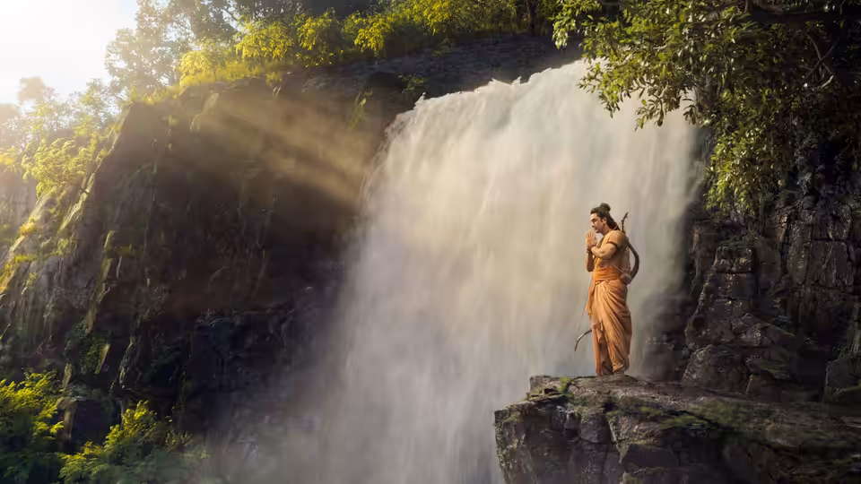 Ram (Ranbir Kapoor) standing on a cliff near a waterfall