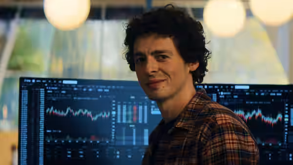 Sam Bankman-Fried (Anthony Boyle) turns from cryptocurrency trading screens