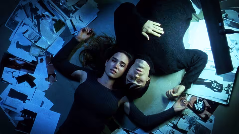 Marion Silver (Jennifer Connelly) and Harry Goldfarb (Jared Leto) lying on a cluttered floor