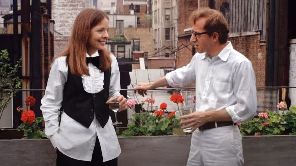 Annie Hall (Diane Keaton) and Alvy Singer (Woody Allen) talking on a balcony