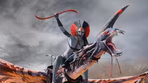 Na'vi warrior raising a red weapon while riding a roaring flying beast