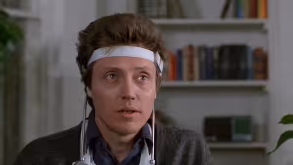 Johnny Smith (Christopher Walken) with headband and wires attached looking ahead