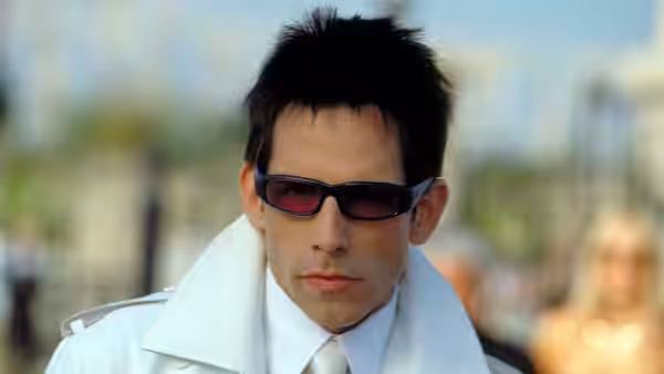 Derek Zoolander (Ben Stiller) in white coat and sunglasses outdoors