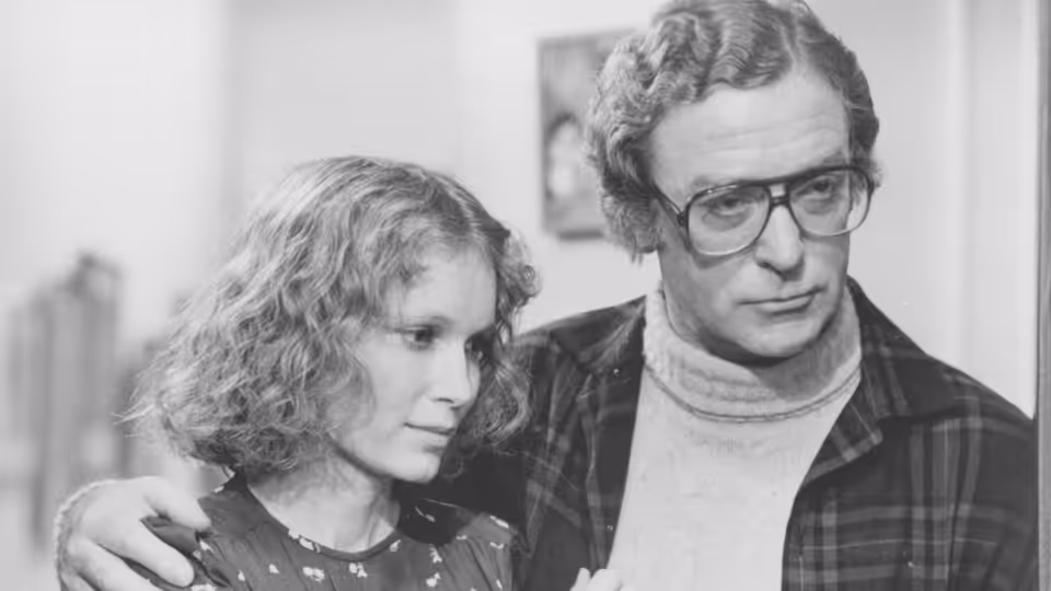 Mickey Sachs (Woody Allen) with his arm around a curly-haired woman