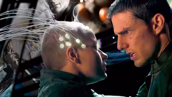 Chief John Anderton (Tom Cruise) staring at a man with head implants