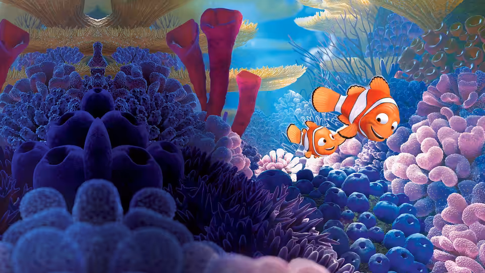 Marlin (Albert Brooks) and Nemo (Alexander Gould) swimming among vibrant coral formations