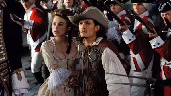 Elizabeth Swann (Keira Knightley) and Will Turner (Orlando Bloom) before red-coated soldiers