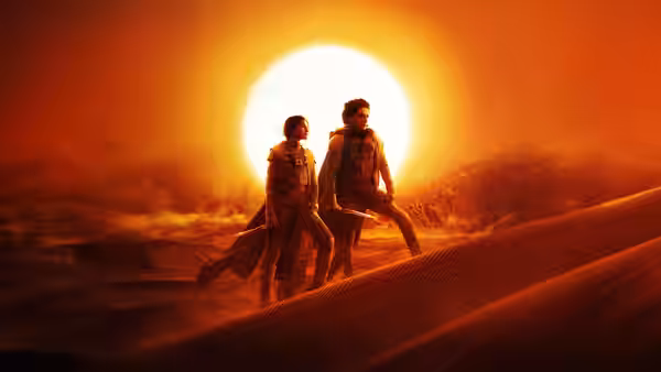 Paul Atreides (Timothée Chalamet) and Chani (Zendaya) on desert dunes at sunset